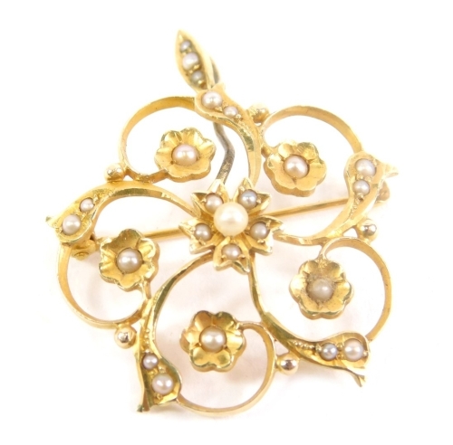 A floral pendant brooch, set with seed pearls, plain bin back, marked 14K and Birks, 2cm high, 4g all in.