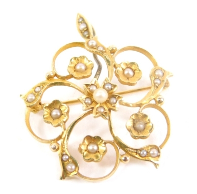 A floral pendant brooch, set with seed pearls, plain bin back, marked 14K and Birks, 2cm high, 4g all in.