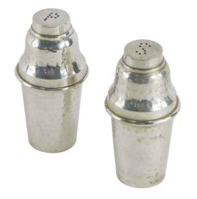 A novelty silver plated cruet set, Culinary Concepts, comprising salt and pepper pots formed as cocktail shakers, 9cm high, marked beneath. (2)