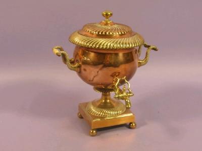 A mid 19thC copper and brass samovar with turned bone handles and gadrooned borders