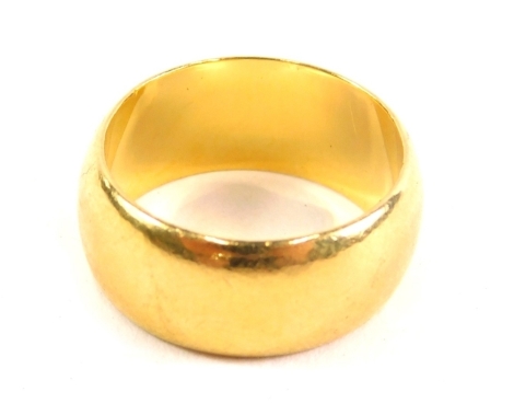 A 22ct gold wedding band, size K, 8.1g.