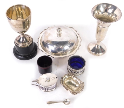 Various silver, a George V silver trophy, egg shaped bowl on inverted stem and ebonised foot, dated 1938, Birmingham 1933, 16cm high, various cruet items, silver open salt, silver stem vase, silver muffin dish, etc. (a quantity)