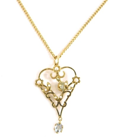 An Edward VII heart shaped pendant, florally set with pearls and aquamarine, 4cm high, attached to a slender link necklace.