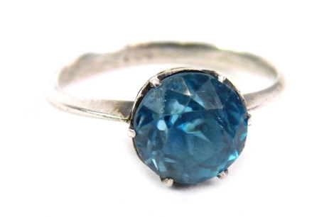 A dress ring, claw set with blue zircon, size N.