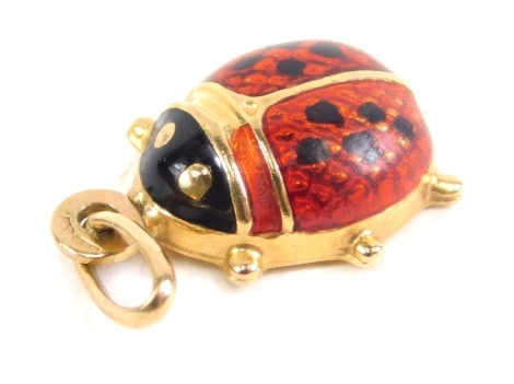 A 9ct gold ladybird charm, with enamelled red and black back, 2cm high, 1g all in.