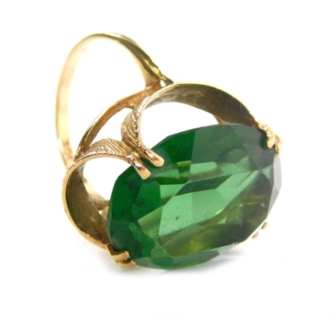 A 9ct gold dress ring, claw set with green stone, size K, 6.1g all in.