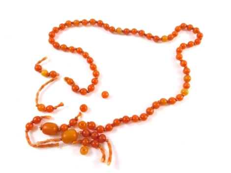 An amber style necklace, with uniform beads and a quantity of other polished amber coloured beads, etc. (a quantity)