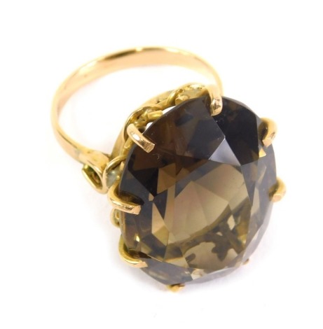 An 18ct gold dress ring, claw set with large citrine coloured stone, size N, 11.6g all in.