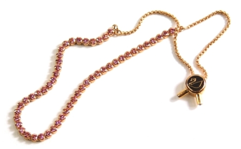 A Swarovski bracelet, uniform set with pink stones, marked with swan, 20cm long. (boxed)