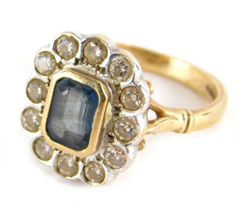 A 9ct gold dress ring, with baguette cut central green stone surrounded by small white stones, on a plain shank, size M, 4.2g all in.