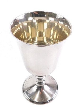 An Elizabeth II silver goblet, with a shaped bowl, baluster stem and circular foot, marked 1983 Henry Stanley on his 80th Birthday, Birmingham 1977, 13cm high, 4.8oz.