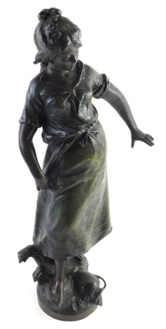 After Moreau. A figure of a lady, in flowing robes, on naturalistic base, brown bronze patinated spelter, 49cm high.