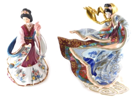 A Franklin Mint Empress of the Snow limited edition figure, number M8107, printed marks beneath, 28cm high, and another the Plum Blossom Princess. (2)