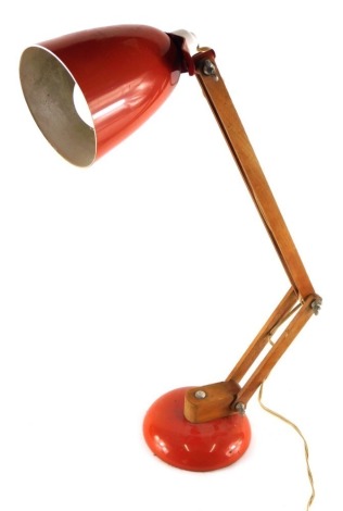 A vintage Anglepoise lamp, with wooden stem, metal orange cone shade and circular foot, 45cm high. WARNING! This lot contains untested or unsafe electrical items.  It is supplied for scrap or re-conditioning only. TRADE ONLY