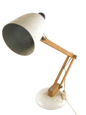 A vintage Anglepoise lamp, with wooden stem and white metal cone shaped shade, on circular foot, 51cm high. WARNING! This lot contains untested or unsafe electrical items.  It is supplied for scrap or re-conditioning only. TRADE ONLY