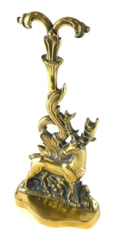 A 20thC brass door stop, with serpentine front, the back plate set with deer with sprouting leaf top, 44cm high.