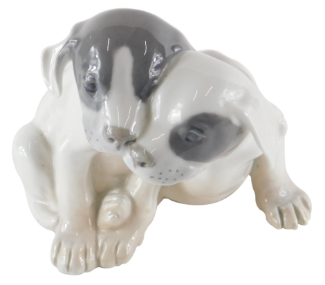 A Royal Copenhagen figure group of two puppies, number 260 YT, printed marks beneath.