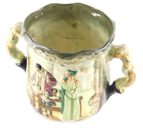 A Royal Doulton limited edition loving cup, The Apothecary, number 425, printed marks beneath, 10cm high.