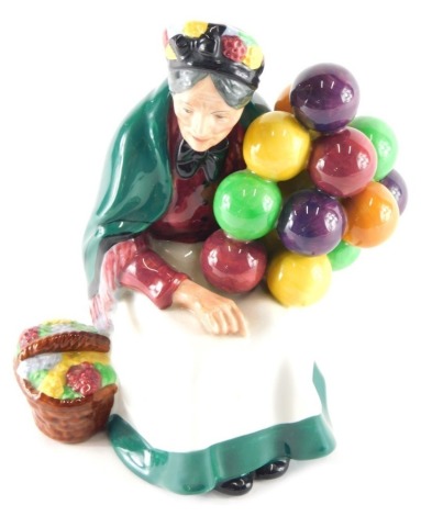 A Royal Doulton figure The Old Balloon Seller, HN1315, printed marks beneath, 19cm high.