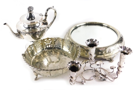 Various silver plated ware, an early 20thC cake stand with mirrored top, on scroll feet, 30cm wide, coffee pot, epergne and basket with spring handle. (a quantity)