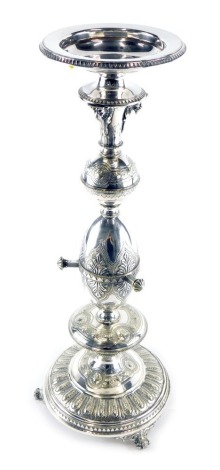 A late 19thC silver plated ecclesiastical candlestick, with orb and egg stem, on a circular foot with scroll feet set with an arrangement of acanthus leaves, with points for candelabra sections (lacking), 50cm high.