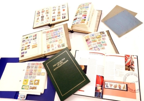 Various stamps, GB and world used, El Salvador, mid 20thC and later, Spanish stamps, blue backs, red backs, South Africa, Sierra Leone, various other world stamps contained in a blue album, collection of 1985 Australian stamps, two exercise books, various