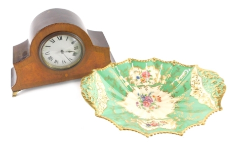 An Edwardian mahogany and walnut inlaid mantel clock, with 9cm diameter Roman numeric dial, in shaped case with boxwood stringing, on brass feet and an Aynsley porcelain dish decorated with panels of flowers. (2)