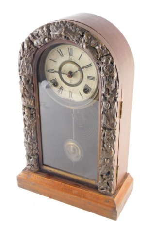 An early 20thC Takano domed mantel clock, the case raised with Oriental figures, revealing a 13cm diameter dial with Roman numerals, marked Made in Japan, with glazed front revealing pendulum, with eight day movement, 42cm high.