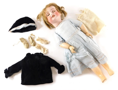 An early 20thC SFBJ bisque headed doll, with sleep eyes, open mouth showing teeth, with articulated limbs and dress, marked to the back, 44cm high, with other accessories.