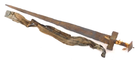 An iron sword, with partial scabbard, tapering blade and T shaped handle, 83cm long. (AF)