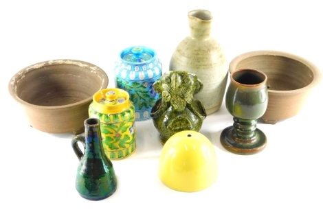 Various studio pottery and effects, a grotesque Toby jug figure in green glazes, unmarked, 21cm high, a Jaipur blue lidded jar, another in yellow, etc. (a quantity)