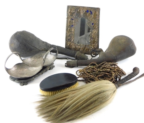 Various Eastern metalware, etc., fly swat with turned handle, 33cm long, leather shot flasks, double handled dish with two sections, Eastern mirror heavily worked with figures with blue glass back, etc. (a quantity)