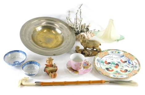 Various porcelain, metalware, and effects, an Eastern dish of circular form with repeat geometric pattern, ram ornament, Goebel Hummel figure of a child playing squeeze box, 7cm high, cabinet cup and saucers, etc. (a quantity) 