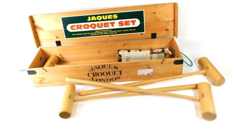 A Jaques croquet set in pine box, to include mallets, etc., 110cm wide.