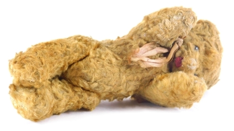 A mid 20thC miniature plush jointed teddy bear, 14cm high.