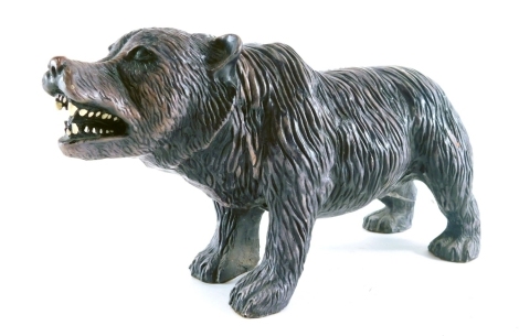 A resin figure of a standing bear.