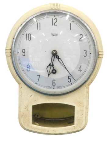 A 1950's Smiths wall clock, with 13cm diameter dial, with chrome plated chapter ring, Arabic numerals, with open section beneath revealing pendulum, 31cm high.