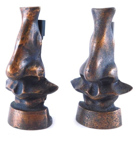 A pair of Dali style bronze menu holders, each of shaped form, unsigned, 13cm high. (2)