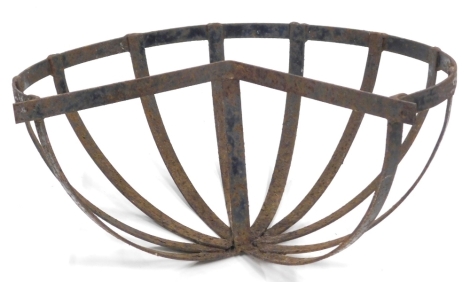 A wrought iron C shaped planter trough hanging, 42cm wide.