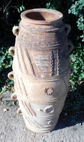 A continental terracotta garden vase, with ten handles, decorated with ovals and geometric devices, 90cm high.