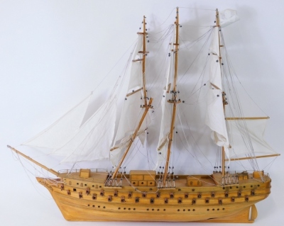 A scratch built model of an 18th or 19thC three masted war ship, 90cm long.