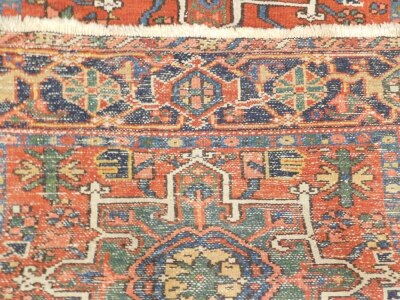 A Karaja rug, with three geometric medallions in blue, beige and green, on a red ground with one wide border, 136cm x 105cm. - 3