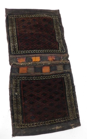 A Turkoman camel bag or Juval, with a geometric design in brown and blue, within narrow borders, 163cm x 60cm overall.