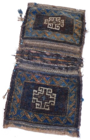 A Turkoman camel bag or Juval, with a central medallion on a brown and blue ground within one wide border, 105cm x 50cm overall.