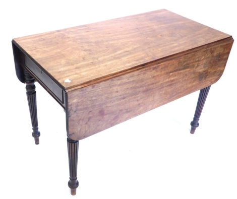 An early 19thC Pembroke table, the top with rounded corners and a reeded edge, above a frieze drawer, on turned tapering reeded legs, 74cm high, 110cm wide.