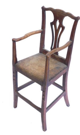 An early 19thC oak child's oak chair, with pierced vase shaped splat, a solid seat on splayed legs.