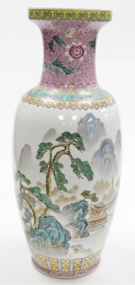 A Chinese porcelain vase, decorated in coloured enamels with buildings, trees, mountains, etc., within pink, turquoise and yellow borders, calligraphy to reverse, square red mark to underside and script, ''Oriental hand painted in China''.