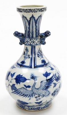 A Chinese porcelain blue and white vase, decorated with birds, flowers, leaves, etc., and with dog of fo handles, unmarked, 23cm high.