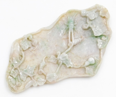 A Chinese jade carving of a lotus leaf, decorated in relief with tendrils and an insect, 15cm wide.