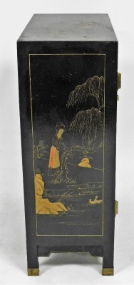 A Chinese black lacquer two door cabinet, decorated with figures, flowering branches, etc., with brass hinges, on brass capped feet, 66cm high, 59cm wide, 28cm deep. - 6